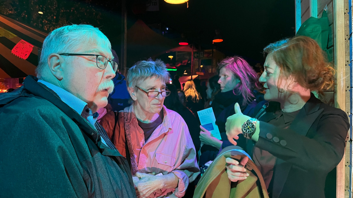 Susanne Schmitt in conversation with  visitors to her "Tiny Gallery".